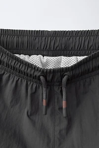 6-14 YEARS/ SWIM SHORTS WITH CONTRAST BANDS