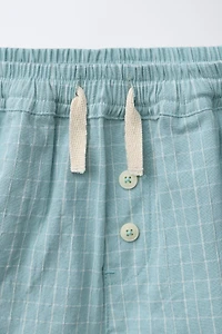 SHORT À CARREAUX ET BOUTONS