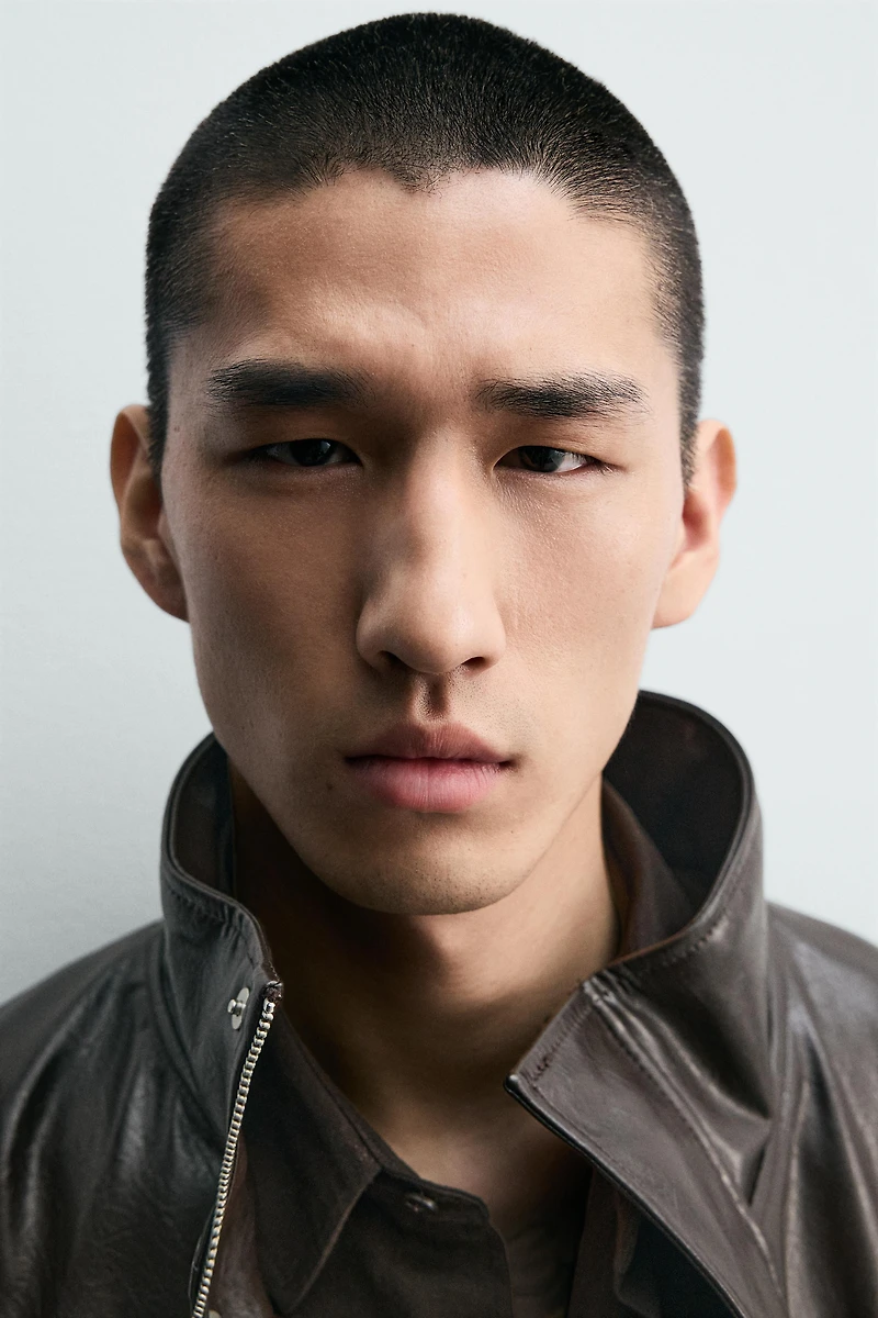 BLOUSON COURT MATIÈRE SYNTHÉTIQUE