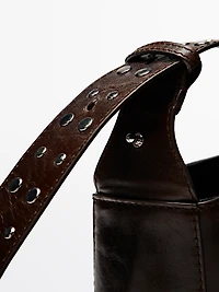 Nappa leather bucket bag with studs