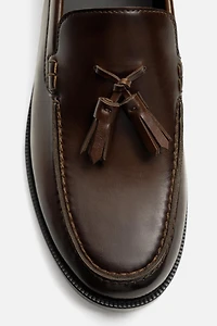 MOCASSINS CHICS À POMPONS