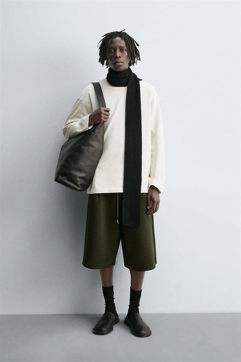 NEOPRENE EFFECT PLEATED LONG BERMUDA SHORTS