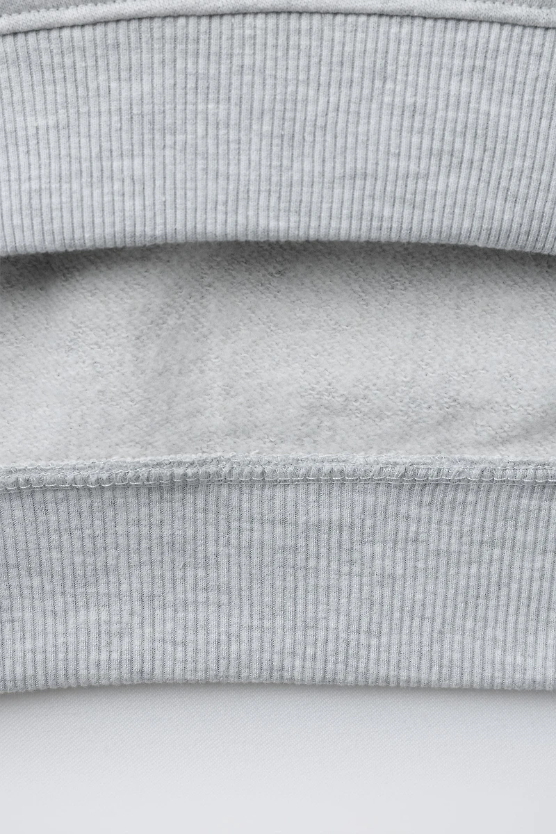RAISED TEXT HOODIE SWEATSHIRT