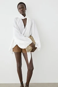Flowing V-neck blouse with tie