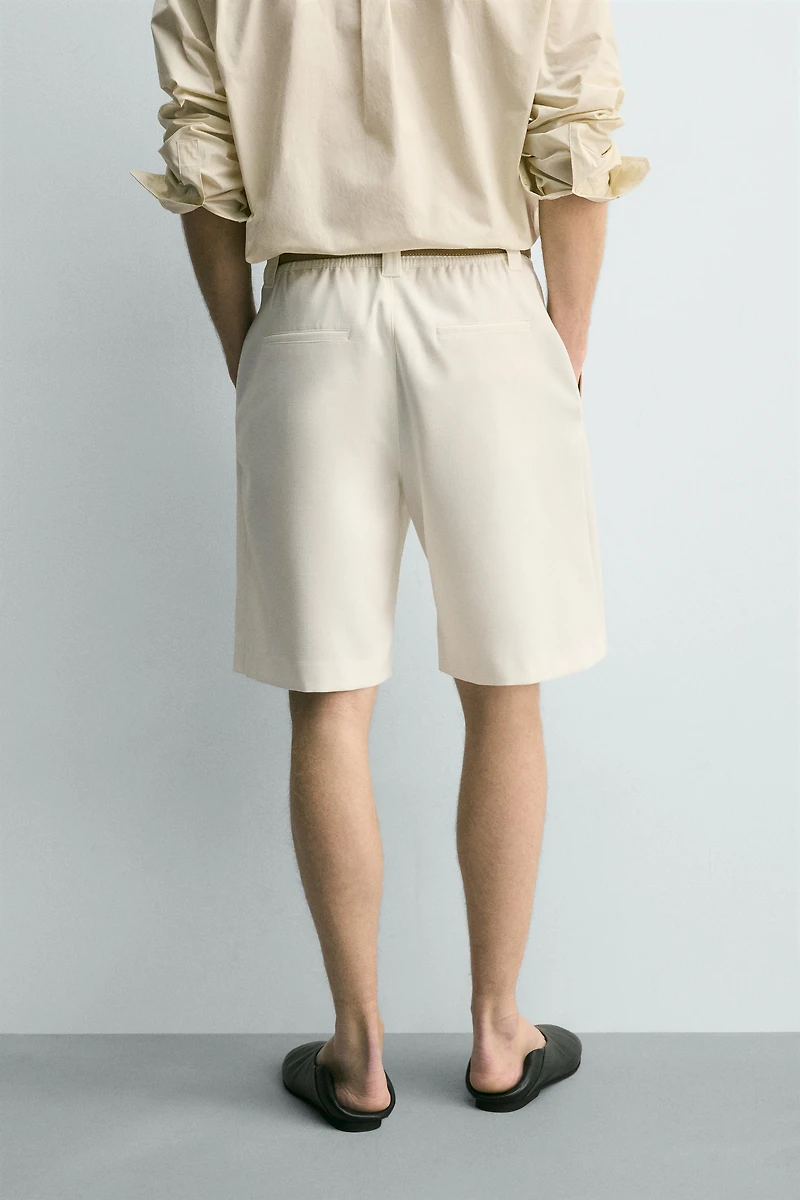 BERMUDA RELAXED FIT PLIS LATÉRAUX