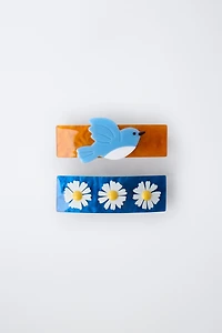 LOT DE DEUX BARRETTES À FLEURS ET OISEAU