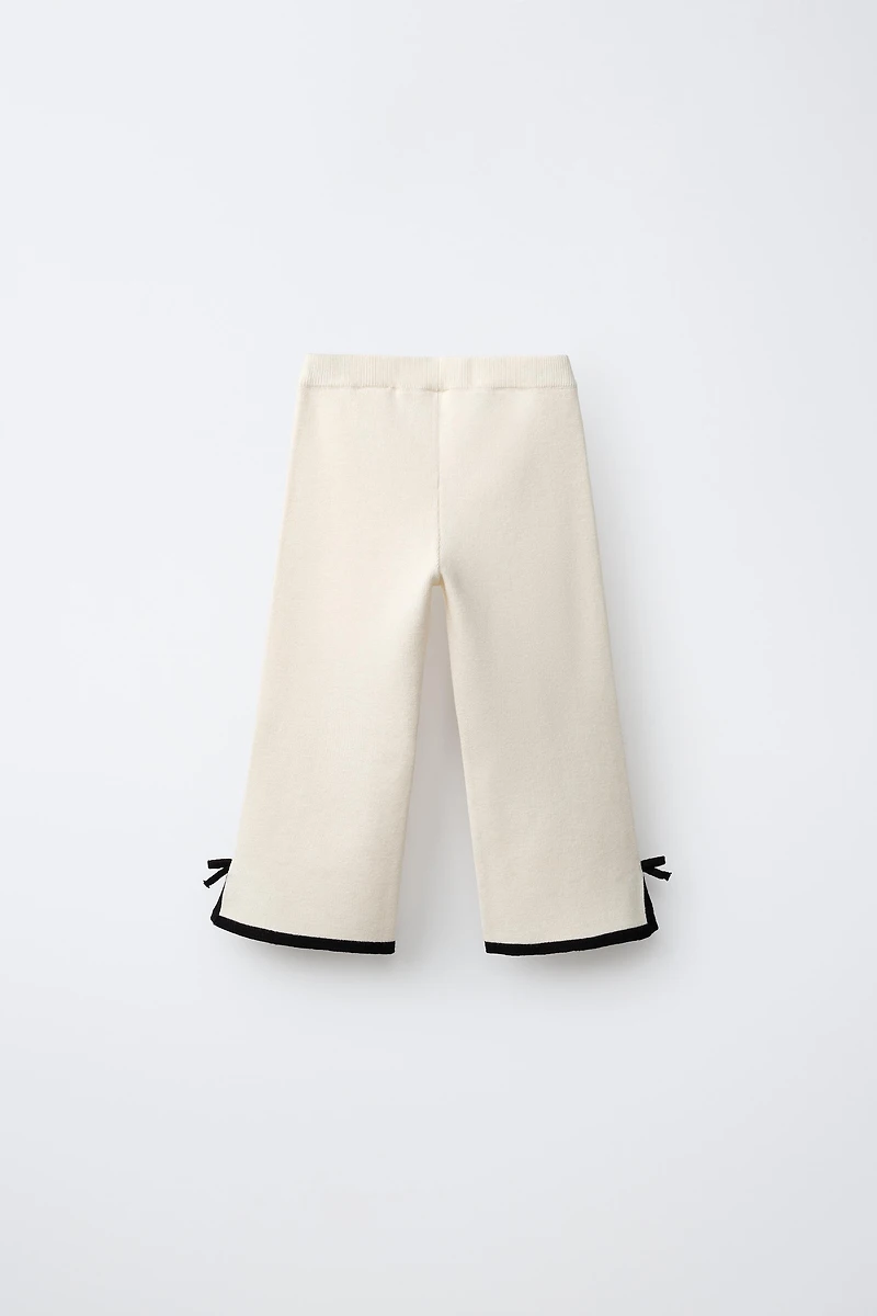FLARED KNIT PANTS WITH BOWS