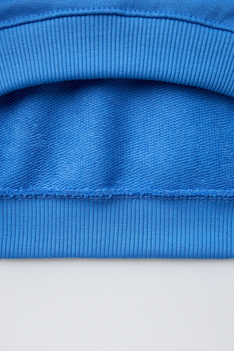 SWEAT À INSCRIPTION BRODÉE