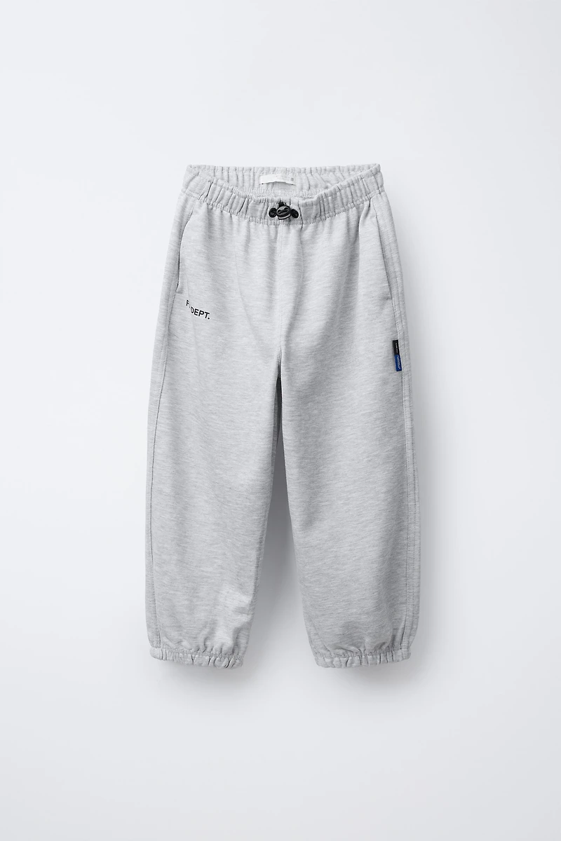 PANTALON DE JOGGING EN MOLLETON STOPPEURS