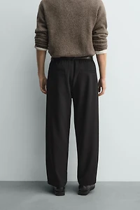 RELAXED FIT PLEATED PANTS