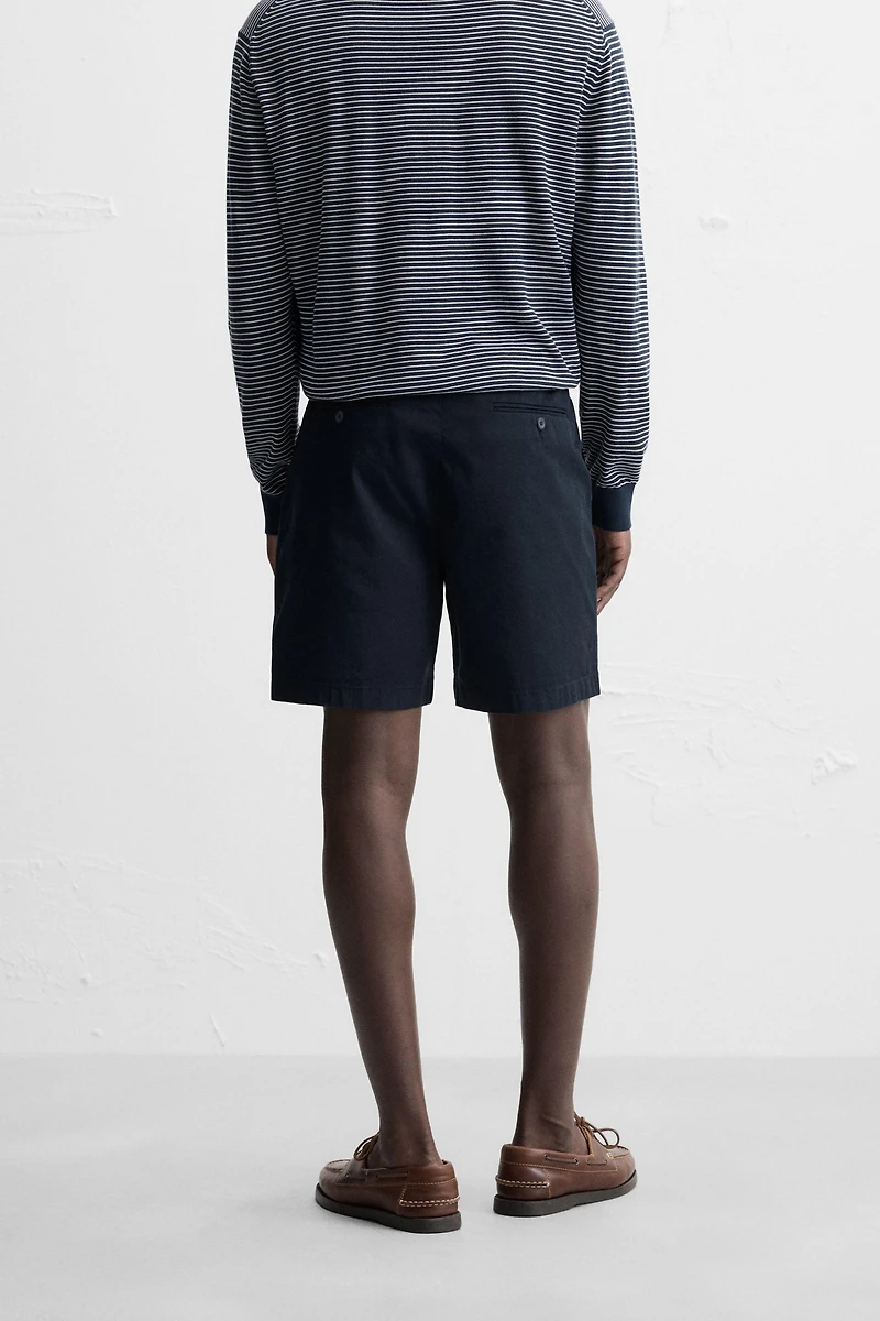REGULAR FIT PLEATED BERMUDA SHORTS