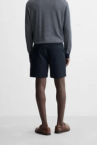 REGULAR FIT PLEATED BERMUDA SHORTS