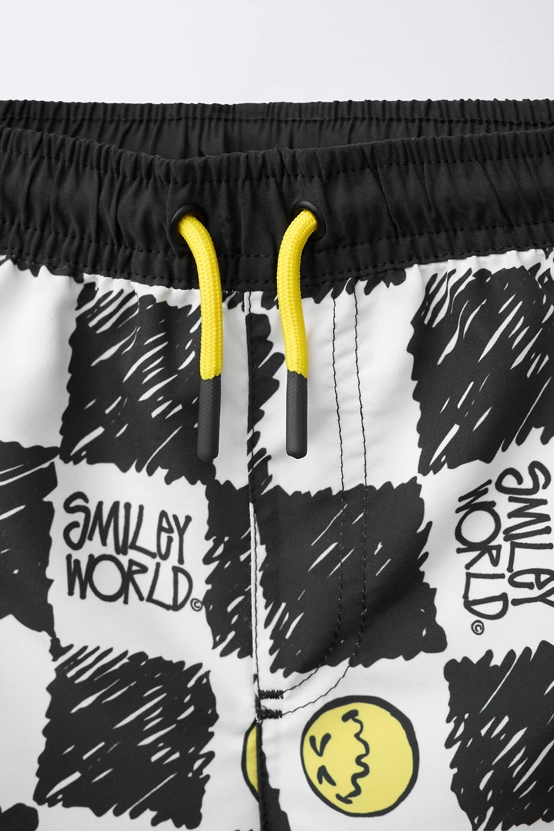 6-14 YEARS/ CHECKERBOARD SMILEYWORLD ® SWIM SHORTS