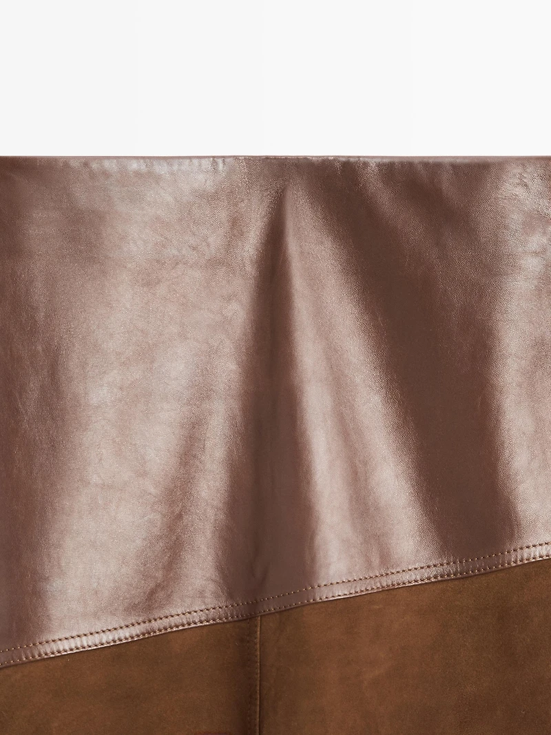 Jupe asymétrique en cuir nappa et daim avec empiècement