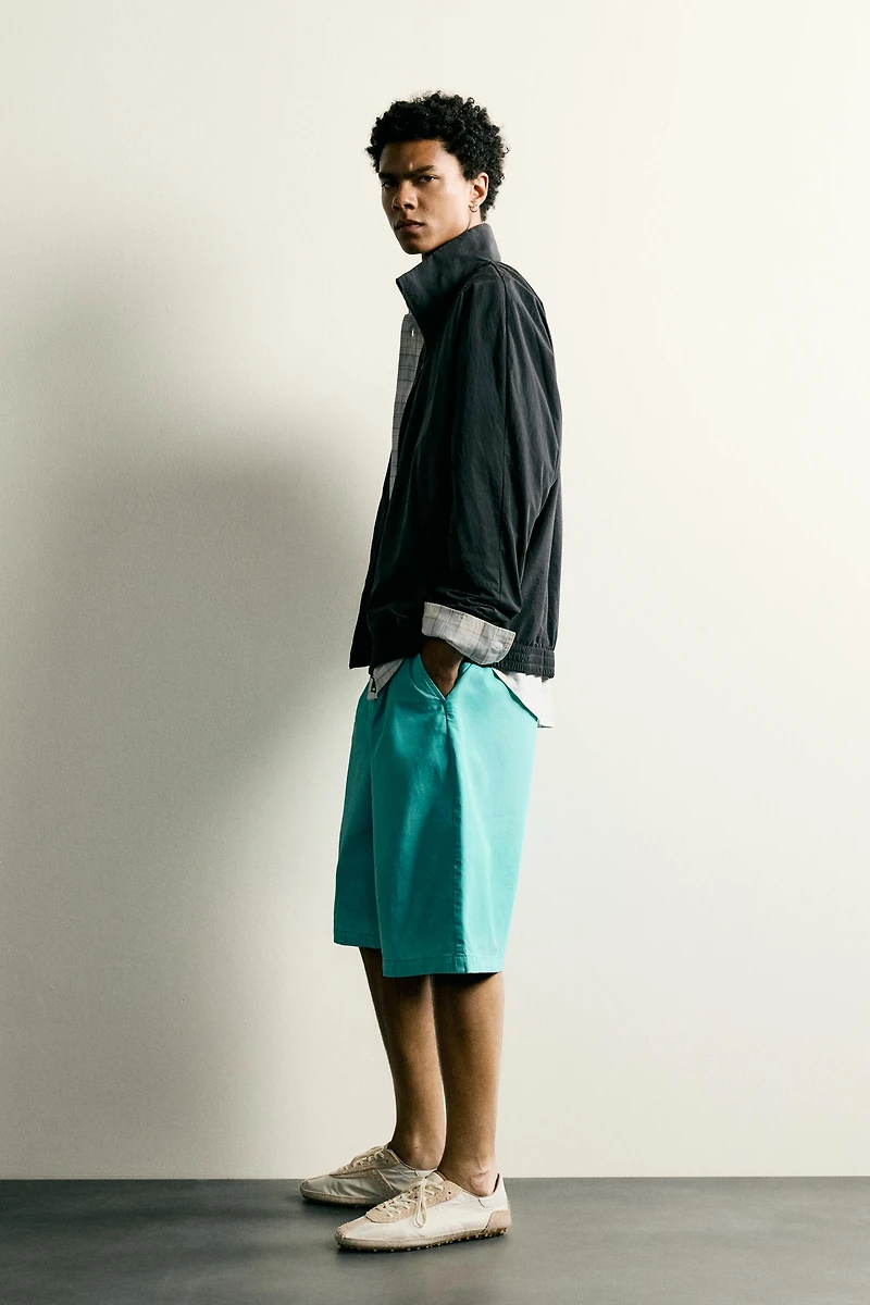 WASHED PLEATED RELAXED FIT SHORTS