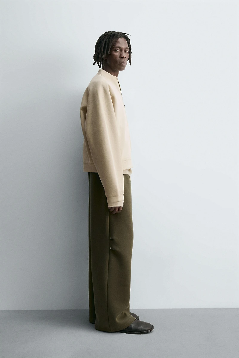 WIDE FIT NEOPRENE EFFECT PANTS WITH STUDS