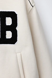 BLOUSON BOMBER MOLLETON INSCRIPTION BRODÉE