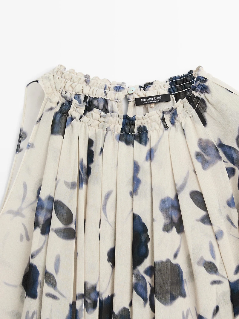 Asymmetric flowing floral print blouse