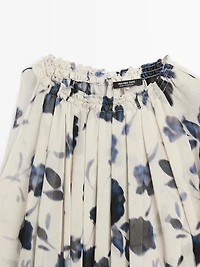 Asymmetric flowing floral print blouse