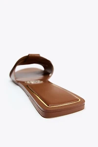 FLAT CROSSED LEATHER SANDALS
