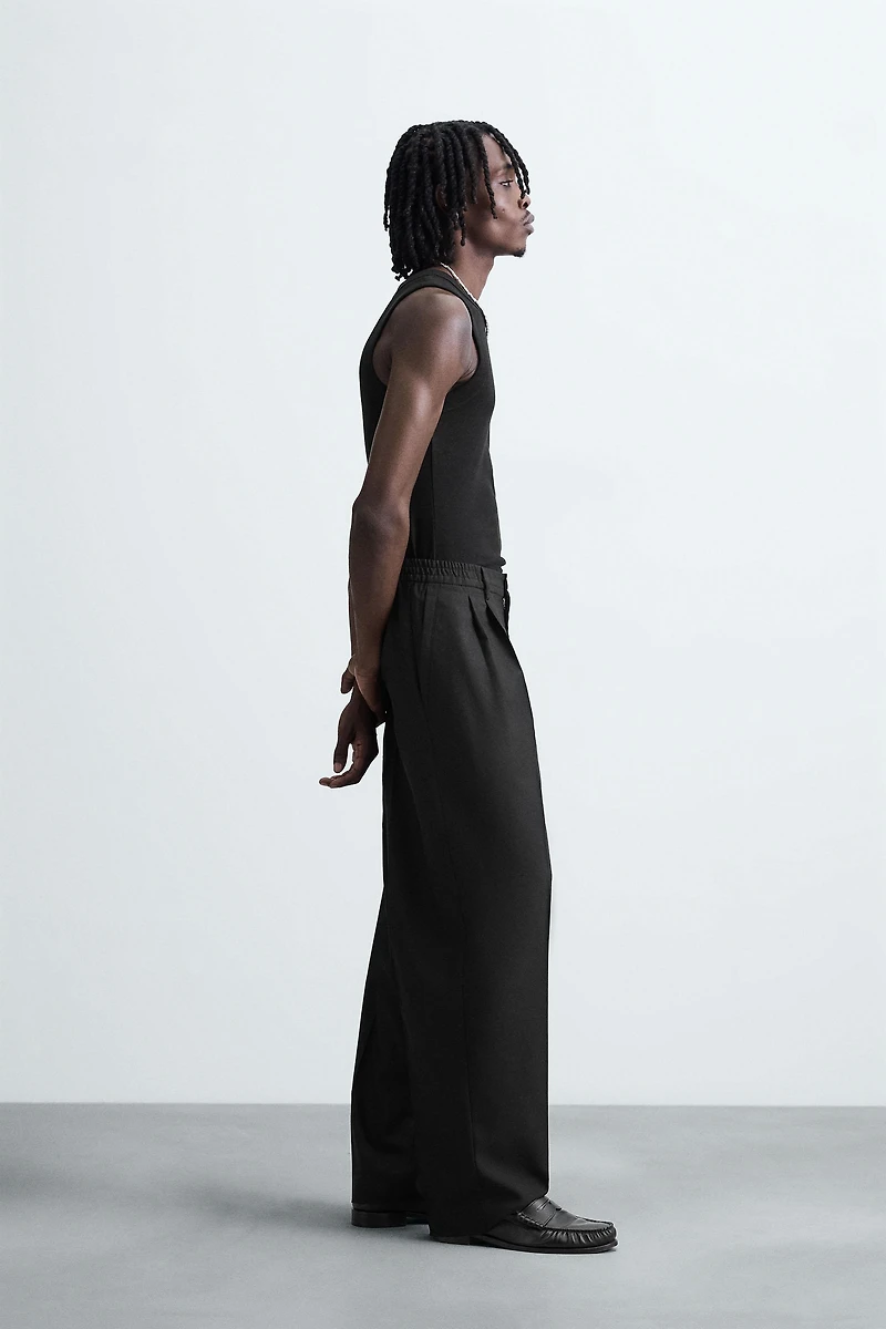FLOWY PLEATED WIDE FIT PANTS