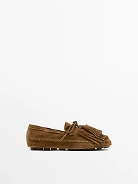 Split suede loafers with fringing and tassels