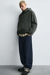 VESTE TECHNIQUE À CAPUCHE