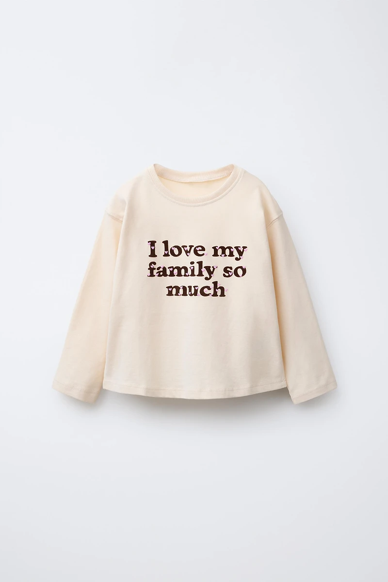 T-SHIRT AVEC INSCRIPTION FLOQUÉE