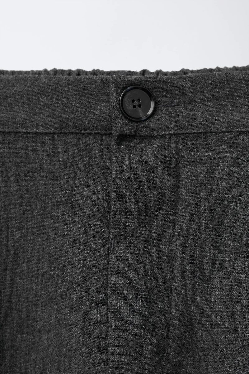 TEXTURED PLEATED PANTS