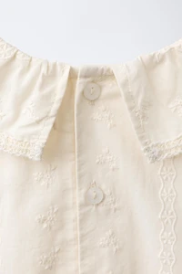 EMBROIDERED FLORAL BODYSUIT