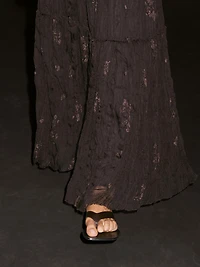 Long pleated skirt with embroidered detail