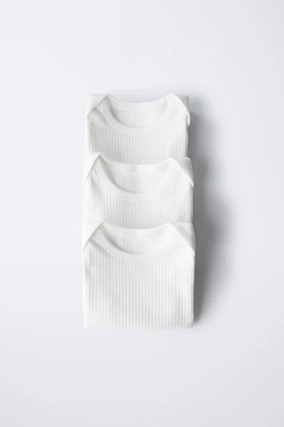 THREE-PACK OF SLEEVELESS BODYSUITS