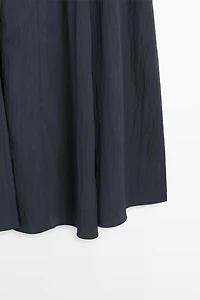 Robe midi fluide avec détails boucles