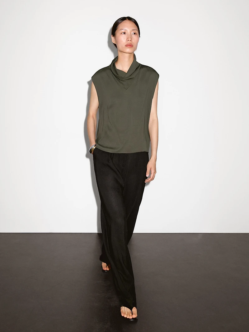 Flowing blouse with draped neck detail