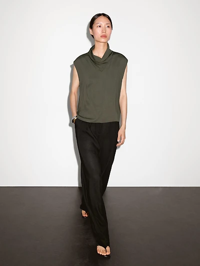 Flowing blouse with draped neck detail