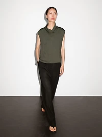 Flowing blouse with draped neck detail