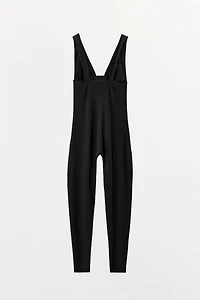 STRAPPY JUMPSUIT WITH POLYAMIDE ZIPPER
