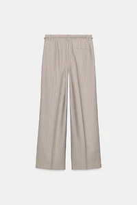 PANTALON CHEVRON AVEC CEINTURE TRESSÉE
