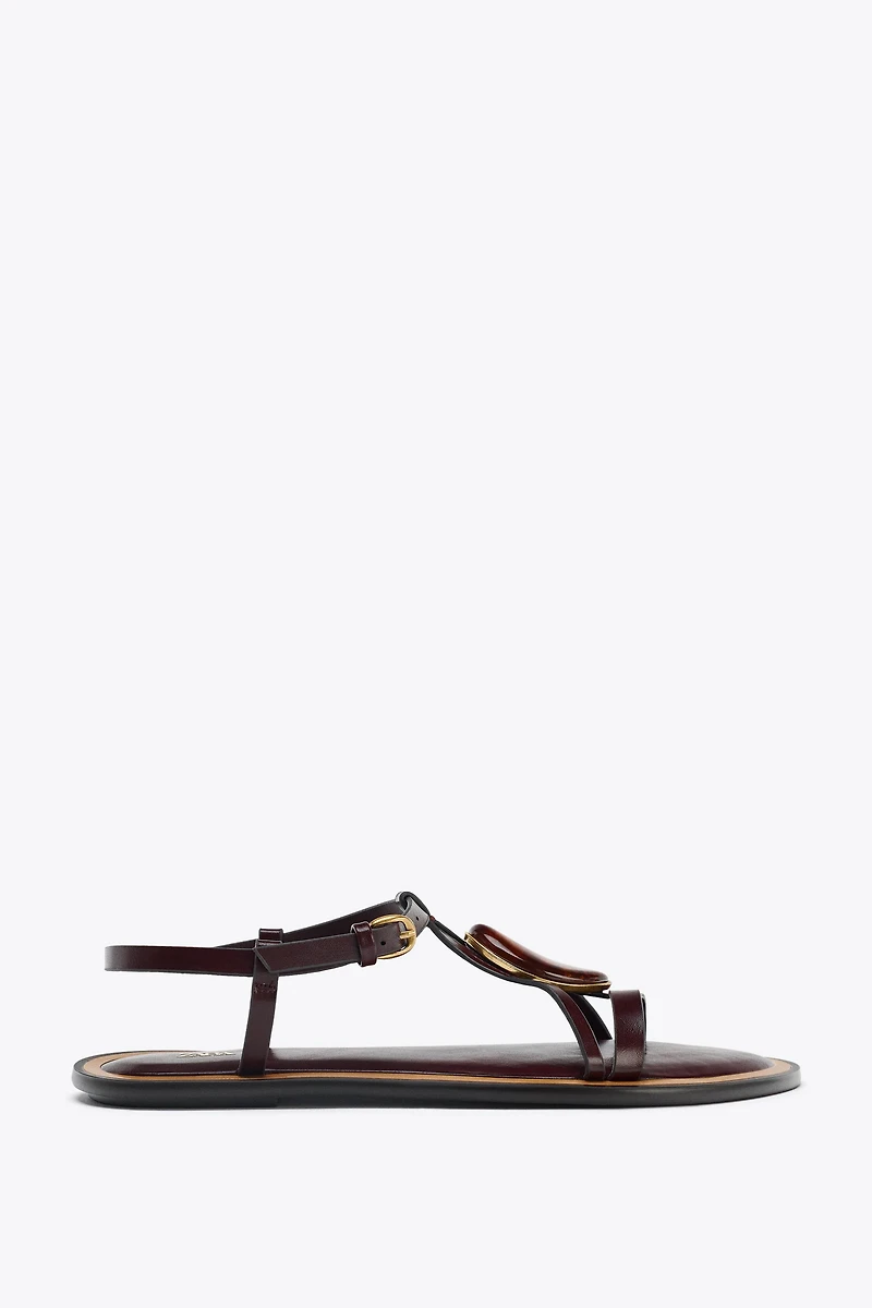 SANDALS WITH METALLIC APPLIQUÉ