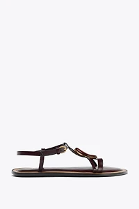SANDALS WITH METALLIC APPLIQUÉ