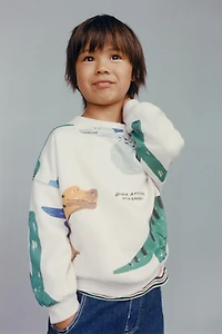 DINOSAUR PRINT SWEATSHIRT