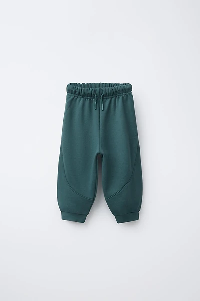 CUT-OUT JOGGER PANTS