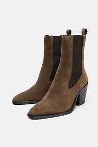 BOTTINES À TALONS EN CROÛTE DE CUIR