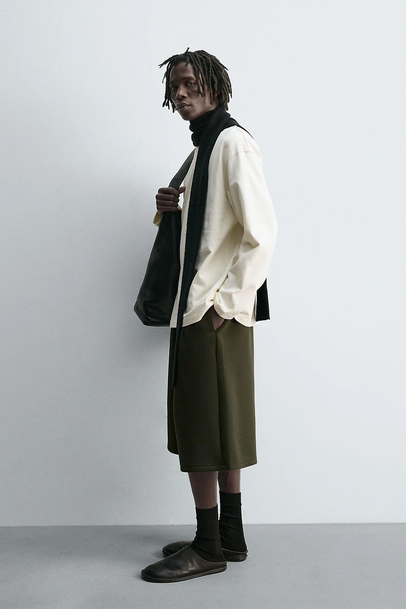 NEOPRENE EFFECT PLEATED LONG BERMUDA SHORTS