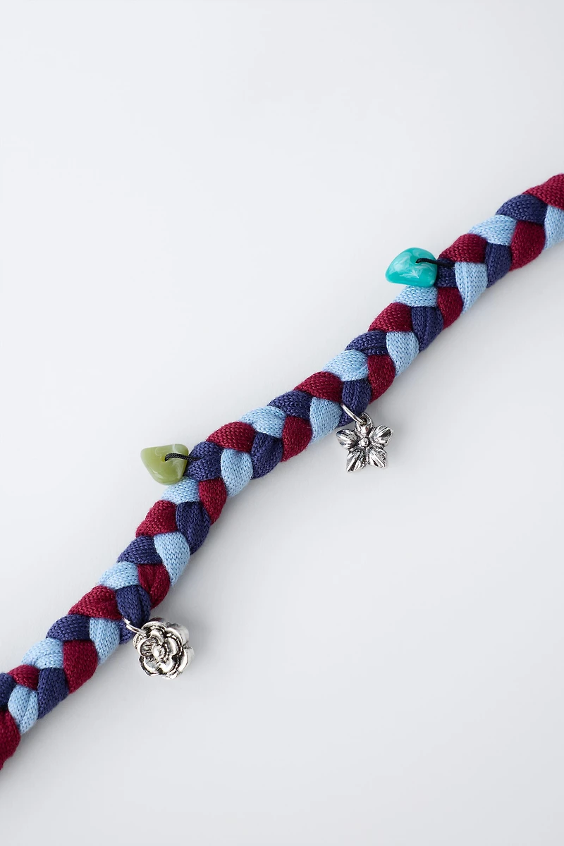 BRAIDED NECKLACE WITH FLOWER PENDANTS