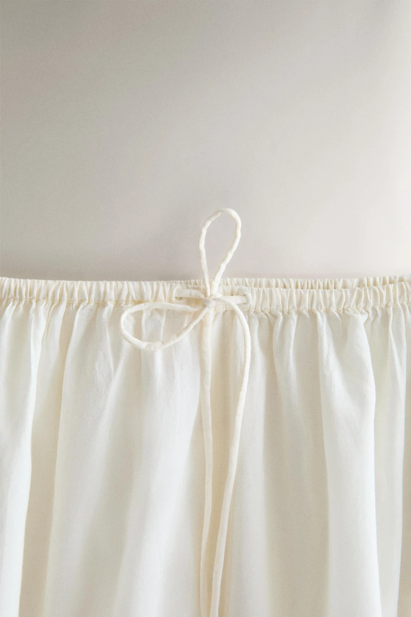SMOCKED TROUSERS WITH LACE AND DRAWSTRINGS