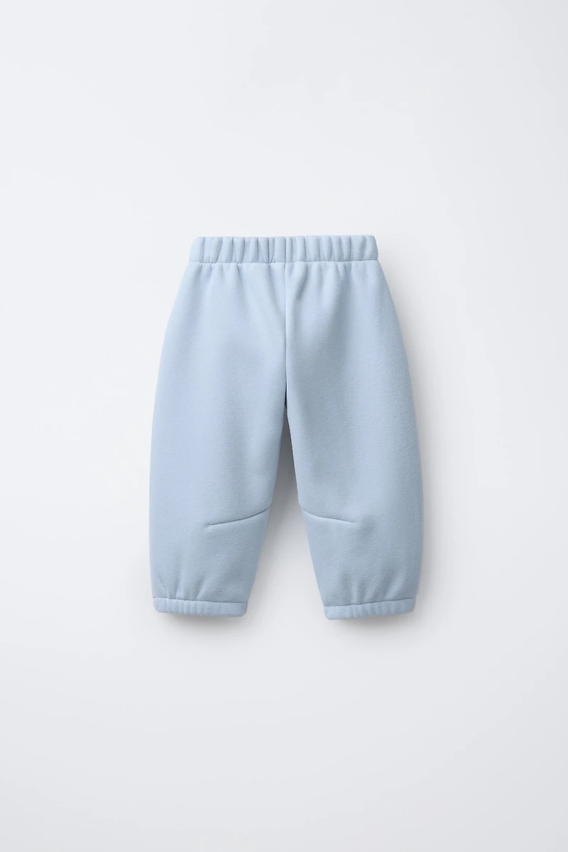 FLEECE LINED BAGGY PANTS WITH LOGO