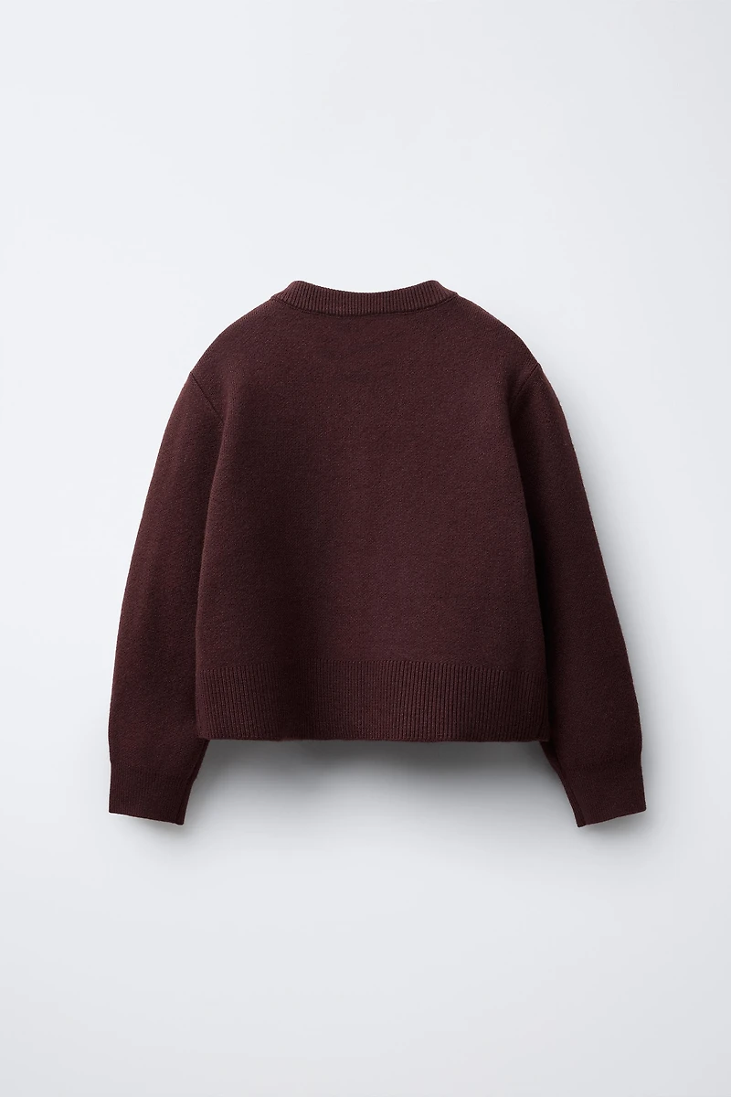 GILET EN MAILLE À POCHES