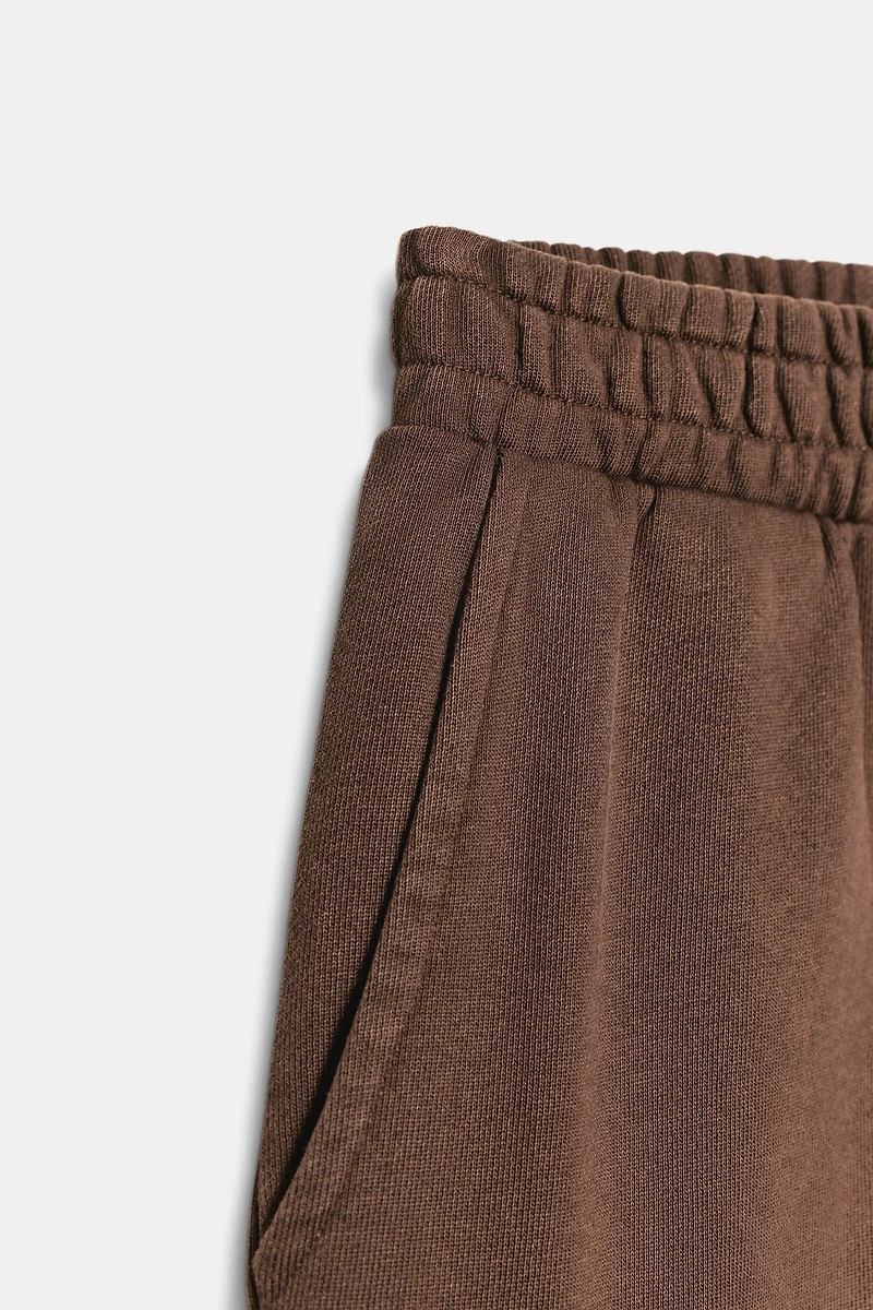 WASHED EFFECT FLEECE PANTS WITH STUDS