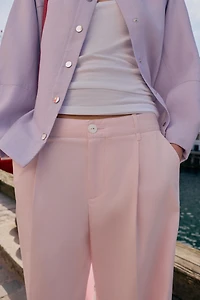 PLEATED CHINO PANTS